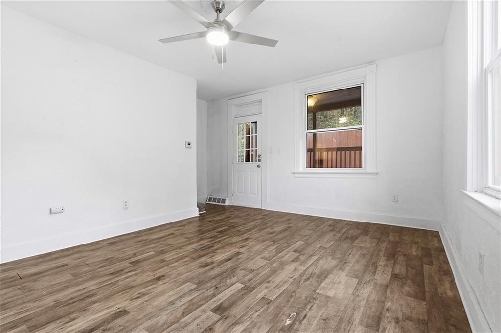 4111 Wildcat Road New Kensington, PA 15068 - Photo 12 of 48 wooden floor in an empty room with a window