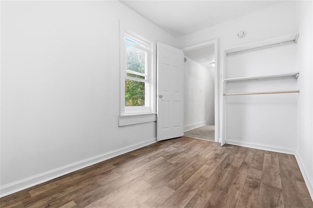 4111 Wildcat Road New Kensington, PA 15068 - Photo 23 of 48 an empty room with wooden floor closet and windows