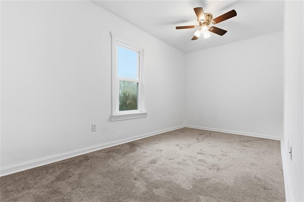4111 Wildcat Road New Kensington, PA 15068 - Photo 24 of 48 an empty room with a window and a fan