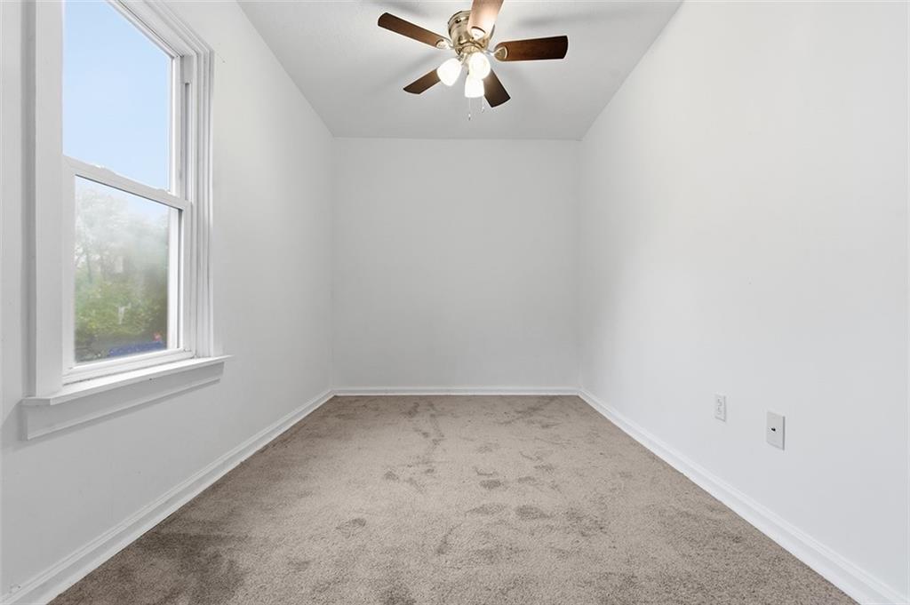 4111 Wildcat Road New Kensington, PA 15068 - Photo 25 of 48 an empty room with a window and a fan