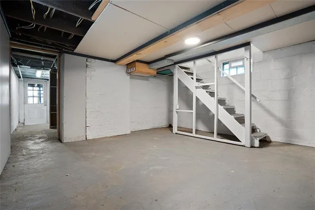 a view of an empty room with stairs