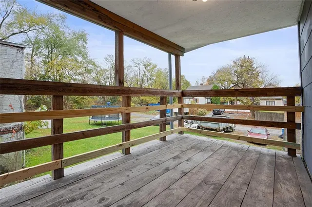 a view of sitting area with furniture and wooden floor