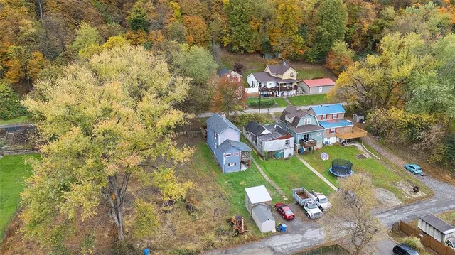 an aerial view of residential houses with outdoor space