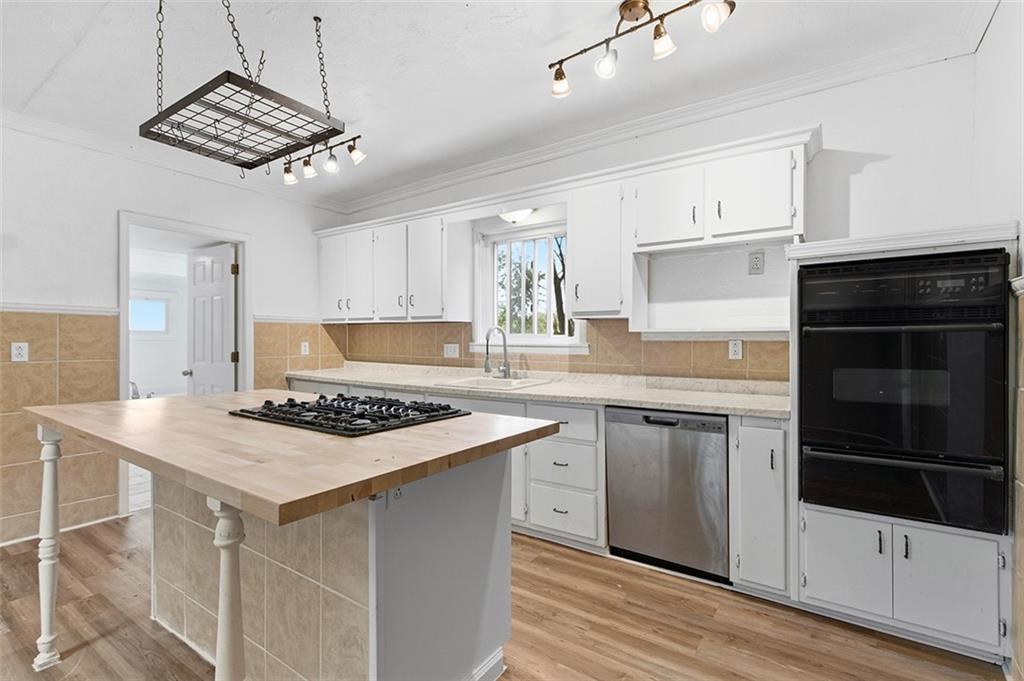 4111 Wildcat Road New Kensington, PA 15068 - Photo 5 of 48 a kitchen with stainless steel appliances a stove sink and cabinets