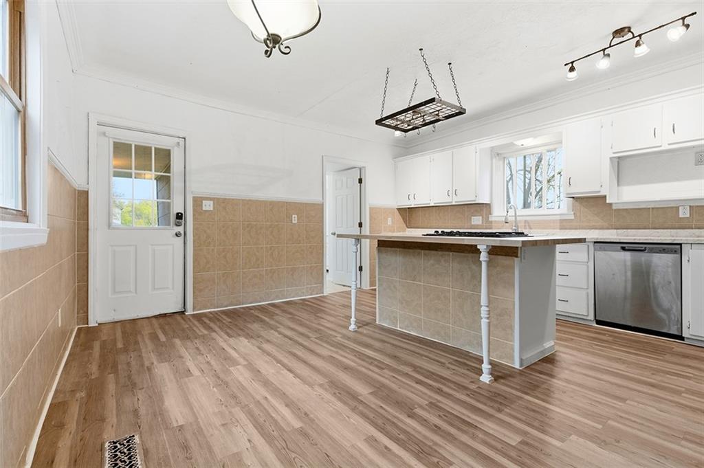 4111 Wildcat Road New Kensington, PA 15068 - Photo 7 of 48 a kitchen with kitchen island stainless steel appliances a sink and cabinets