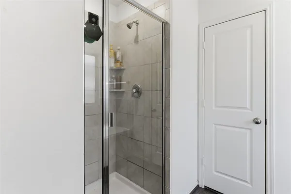 a bathroom with a sink a large mirror and a bathtub