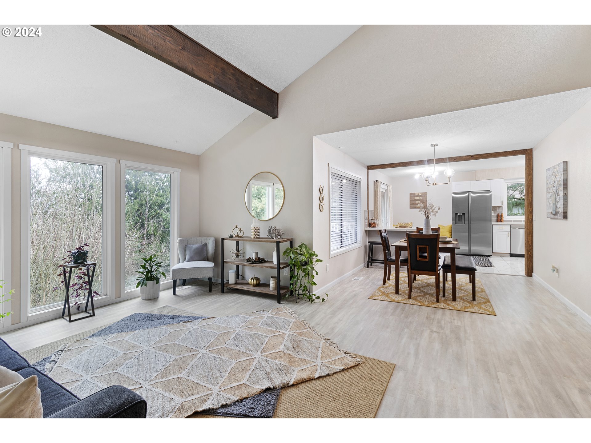 3121 Southwest Orchard Place Gresham, OR 97080 - Photo 11 of 48 a living room with furniture and a large window