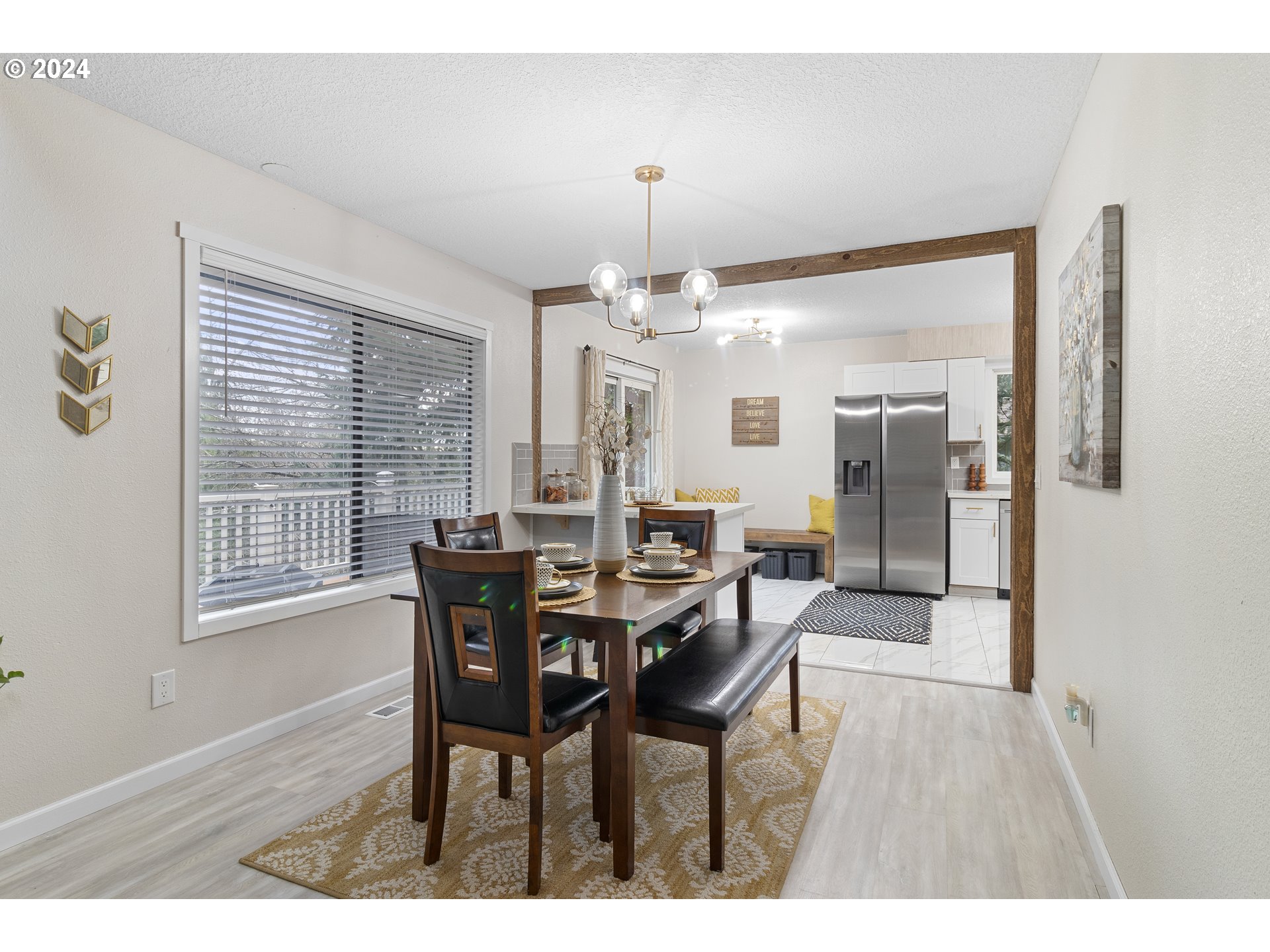 3121 Southwest Orchard Place Gresham, OR 97080 - Photo 12 of 48 a view of a dining room with furniture window and wooden floor