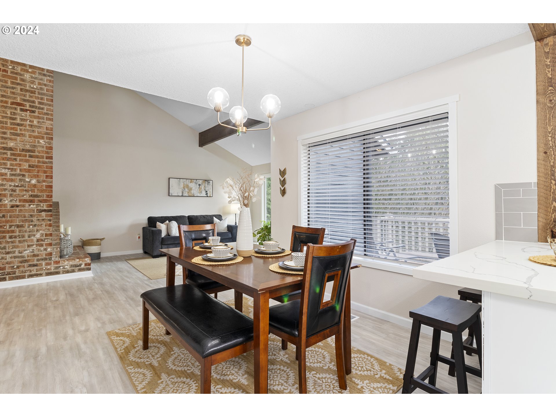 3121 Southwest Orchard Place Gresham, OR 97080 - Photo 14 of 48 a view of a dining room with furniture window and wooden floor