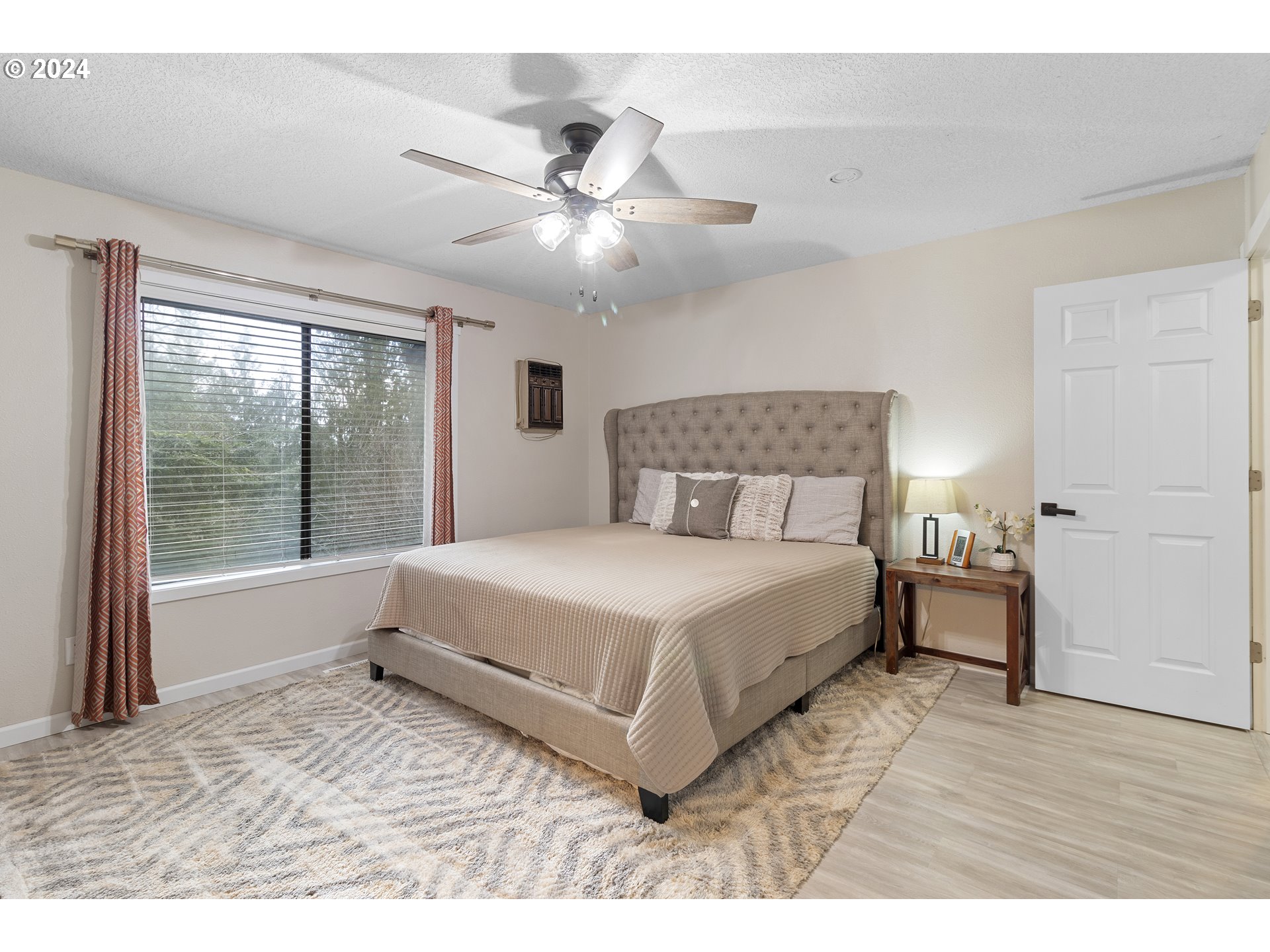3121 Southwest Orchard Place Gresham, OR 97080 - Photo 24 of 48 a bedroom with a large bed and a large window