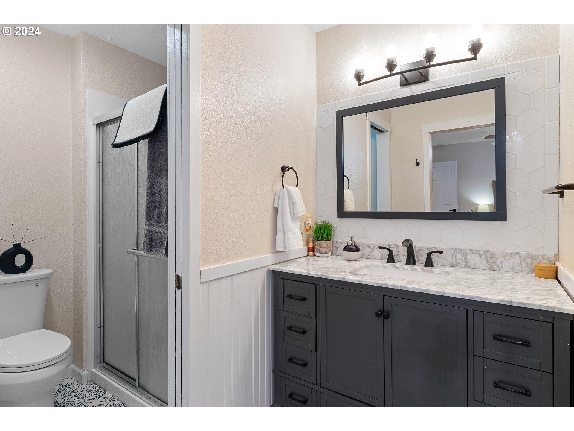 3121 Southwest Orchard Place Gresham, OR 97080 - Photo 25 of 48 a bathroom with a toilet sink and mirror