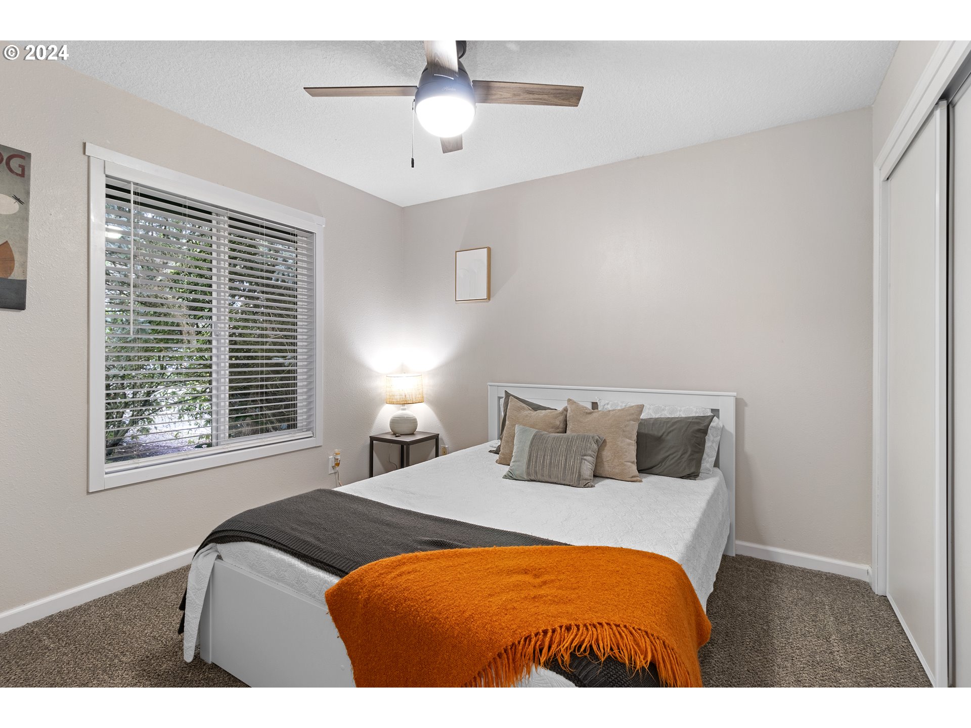 3121 Southwest Orchard Place Gresham, OR 97080 - Photo 27 of 48 a bedroom with a bed and a chandelier