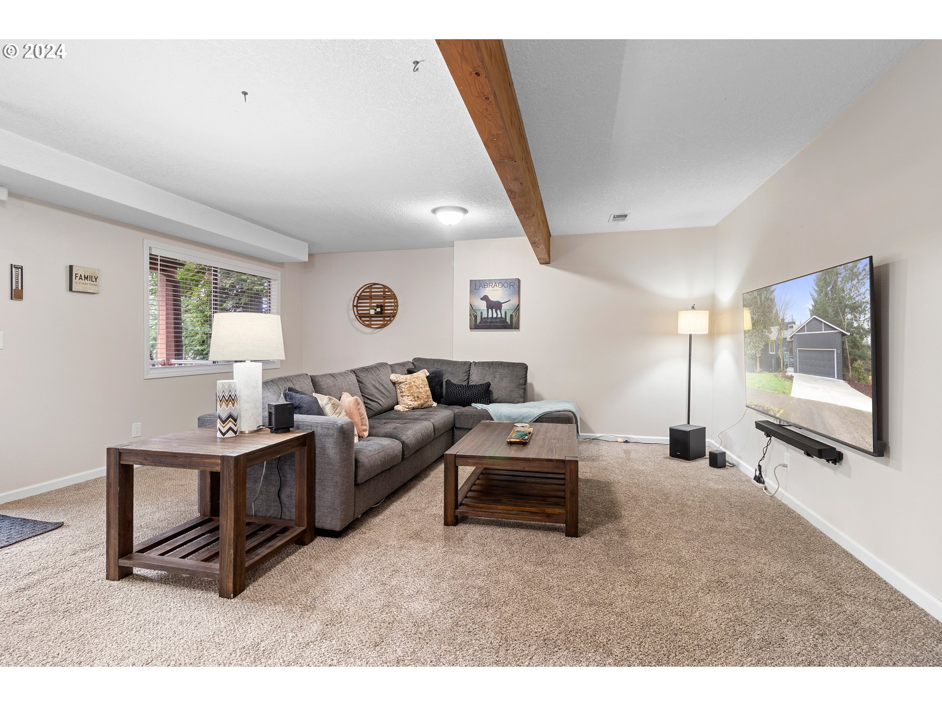 3121 Southwest Orchard Place Gresham, OR 97080 - Photo 30 of 48 a living room with furniture and a flat screen tv