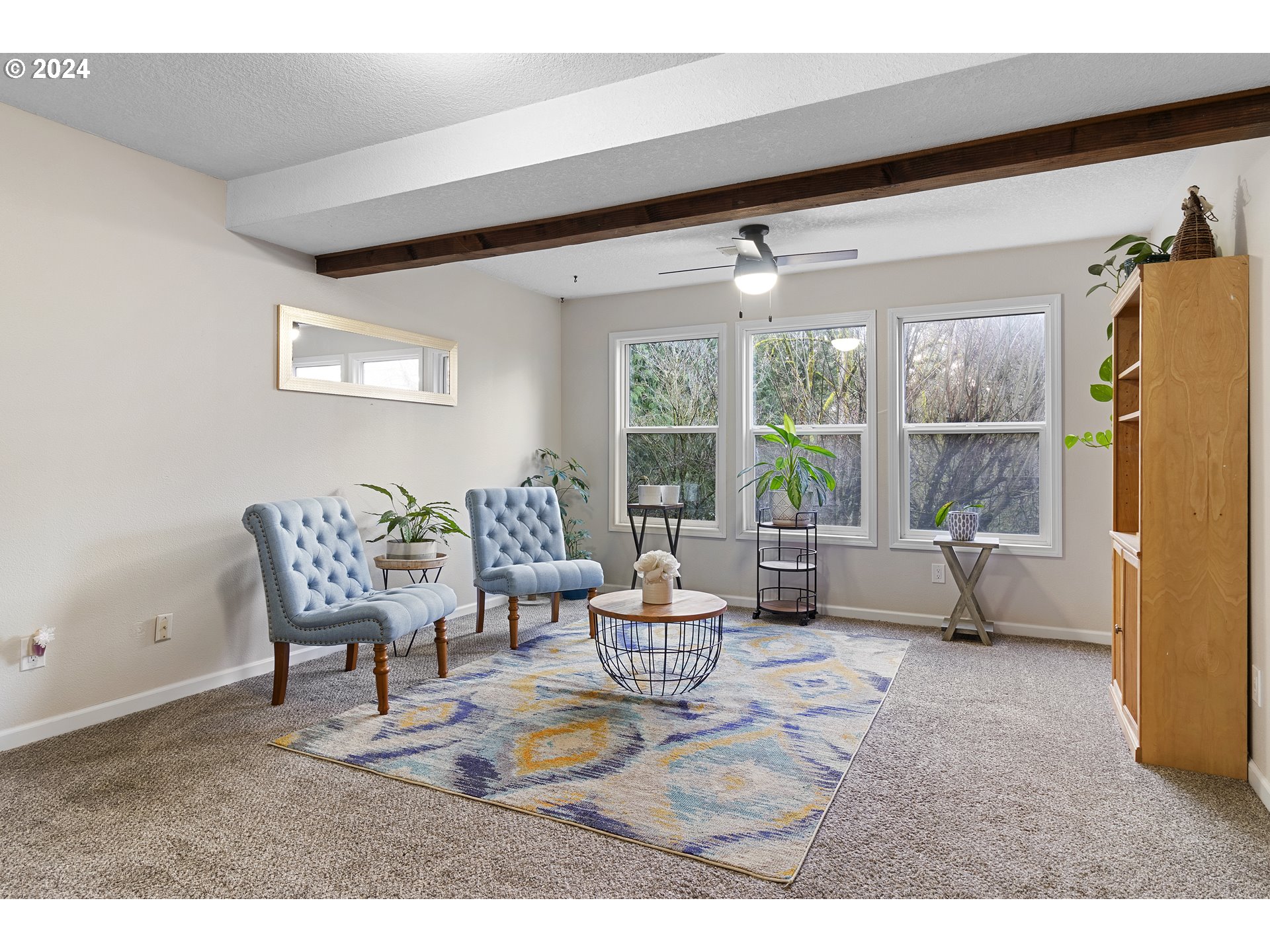 3121 Southwest Orchard Place Gresham, OR 97080 - Photo 33 of 48 a living room with furniture and a large window