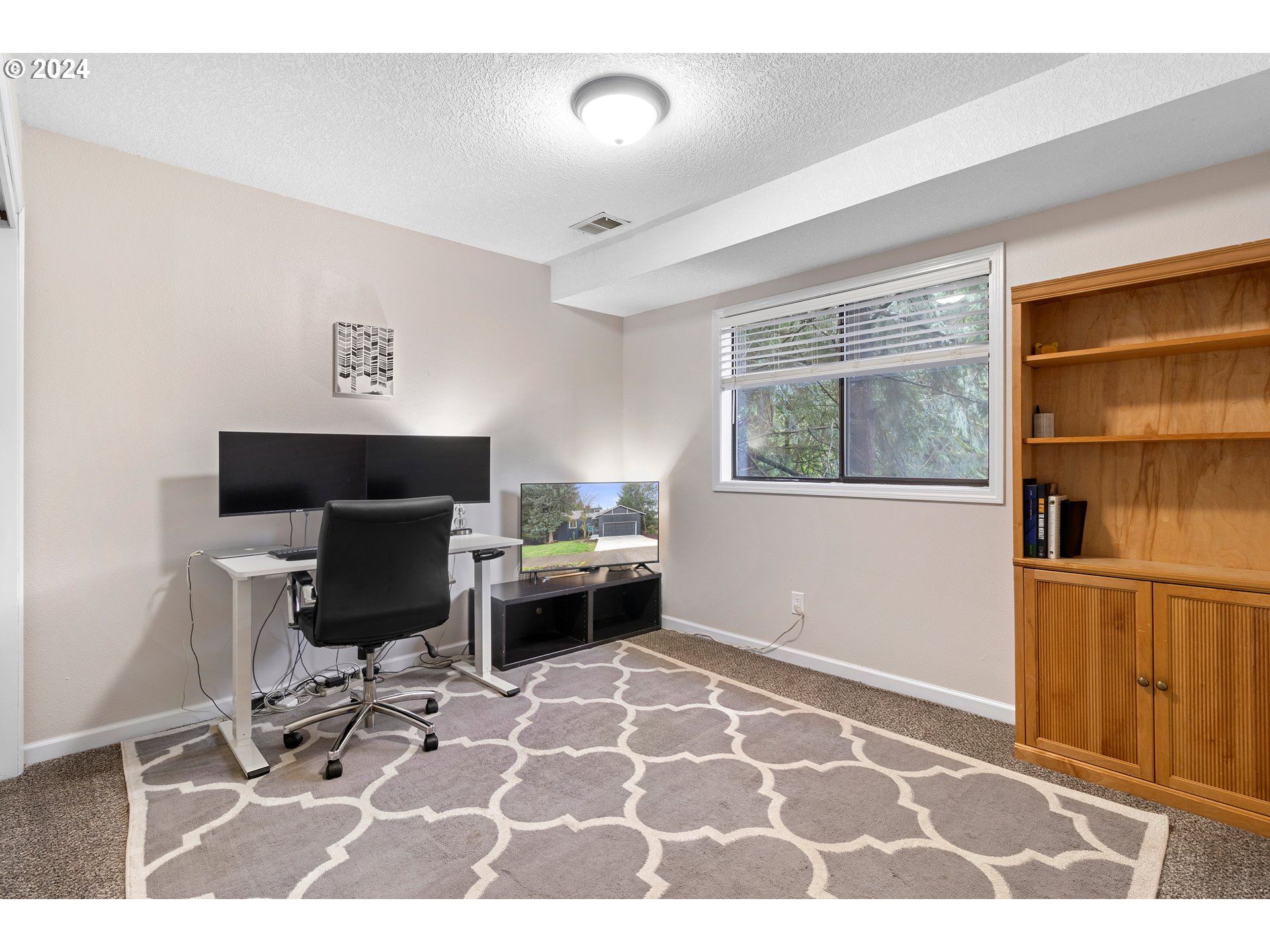 3121 Southwest Orchard Place Gresham, OR 97080 - Photo 37 of 48 a view of a workspace with furniture and a window