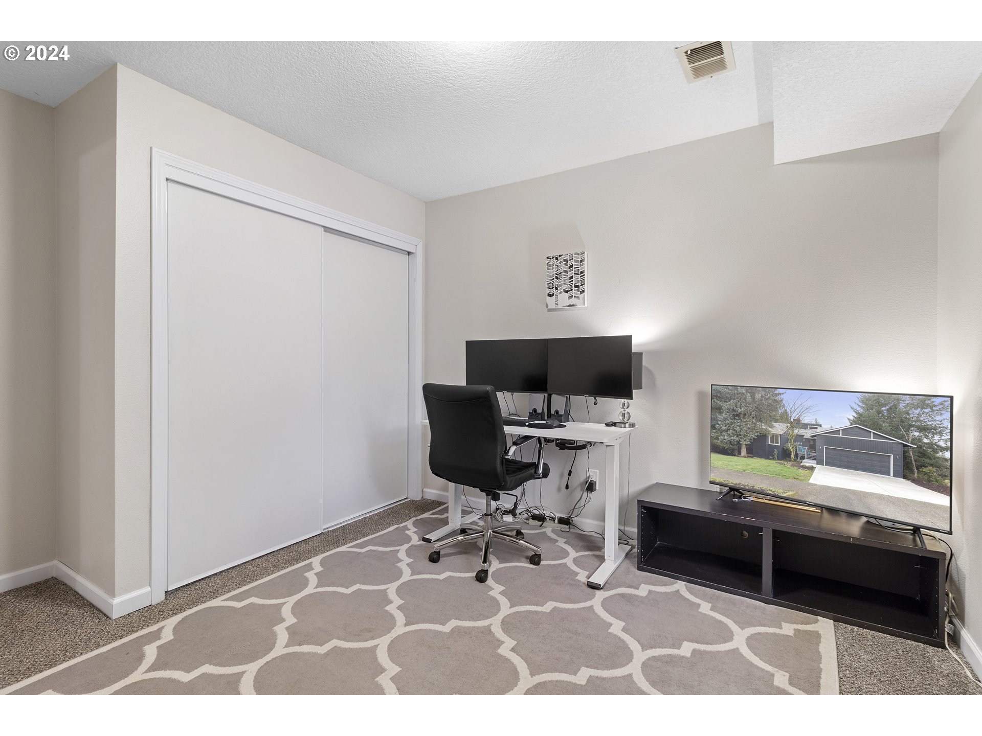 3121 Southwest Orchard Place Gresham, OR 97080 - Photo 38 of 48 a living room with furniture and a flat screen tv