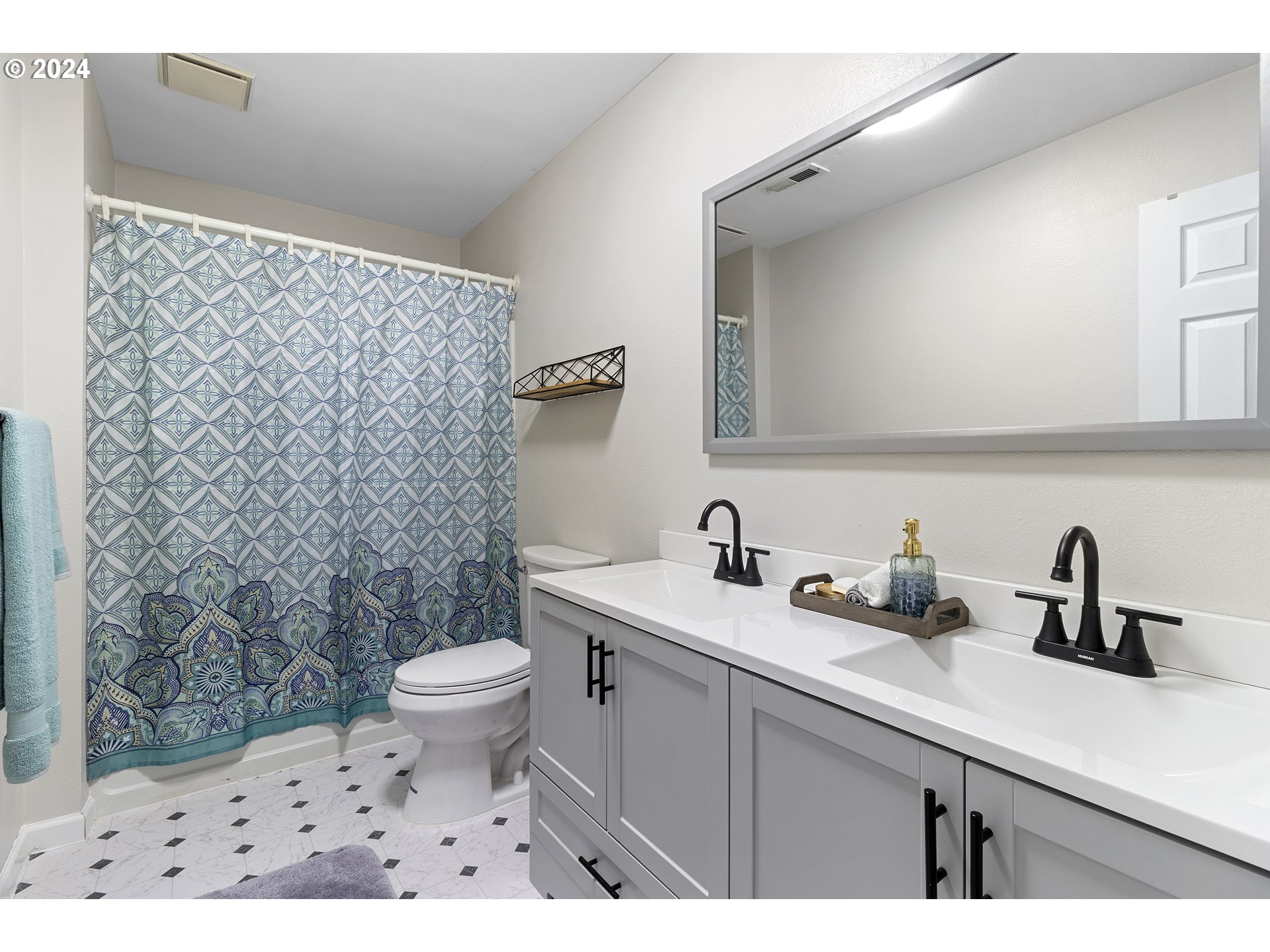 3121 Southwest Orchard Place Gresham, OR 97080 - Photo 39 of 48 a bathroom with a sink a toilet a mirror and shower