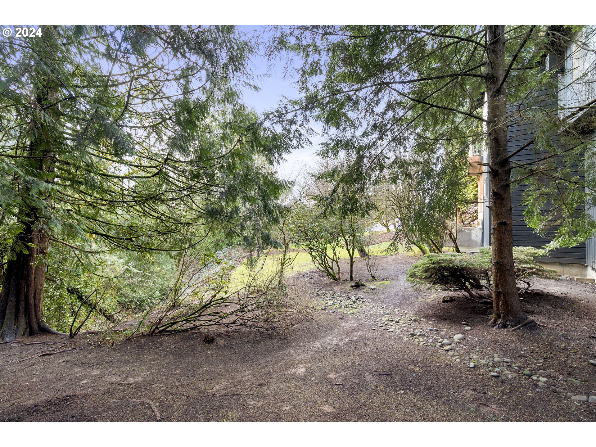 3121 Southwest Orchard Place Gresham, OR 97080 - Photo 44 of 48 a backyard of a house with lots of green space