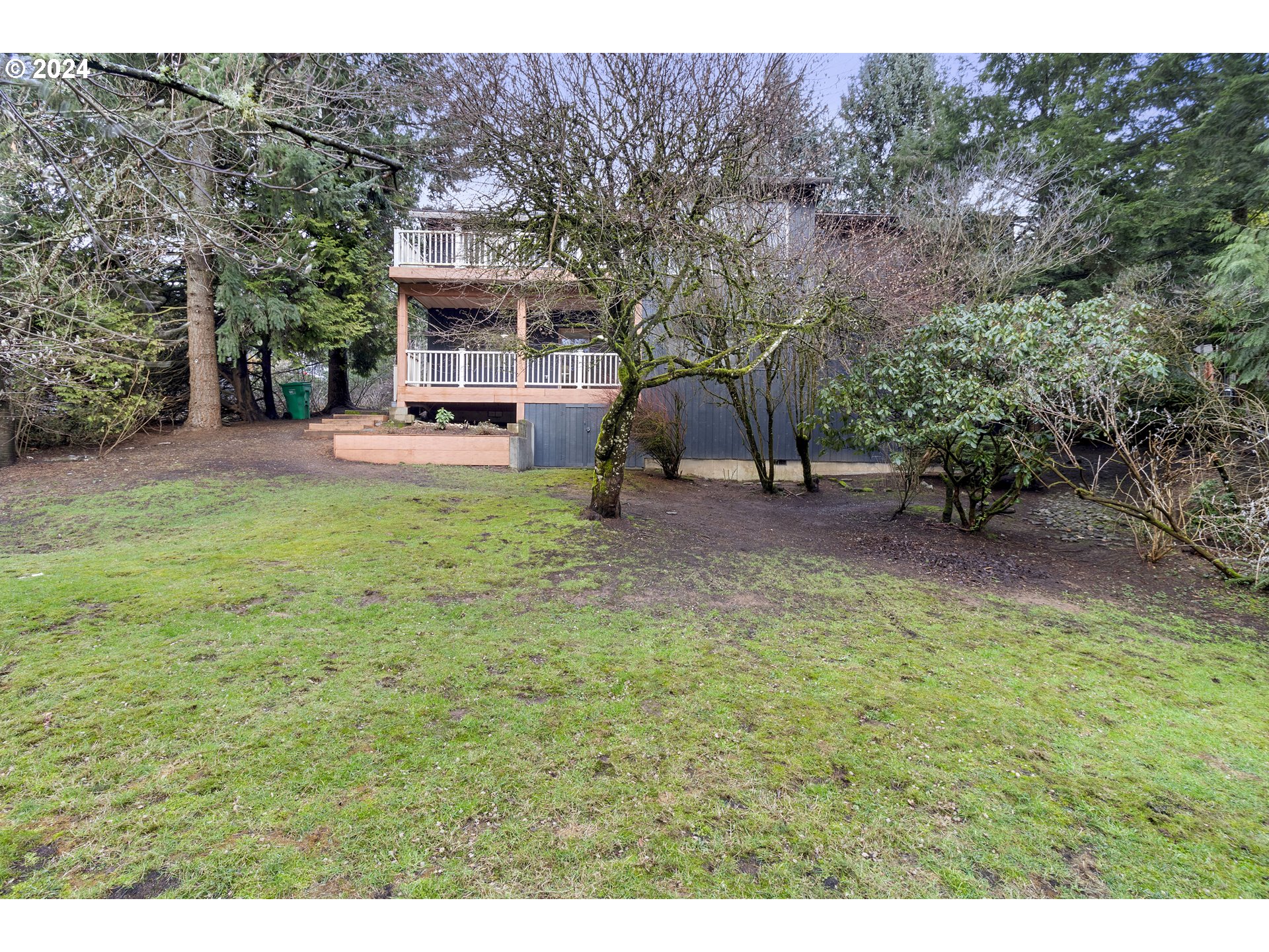 3121 Southwest Orchard Place Gresham, OR 97080 - Photo 46 of 48 a view of a house with backyard porch and sitting area