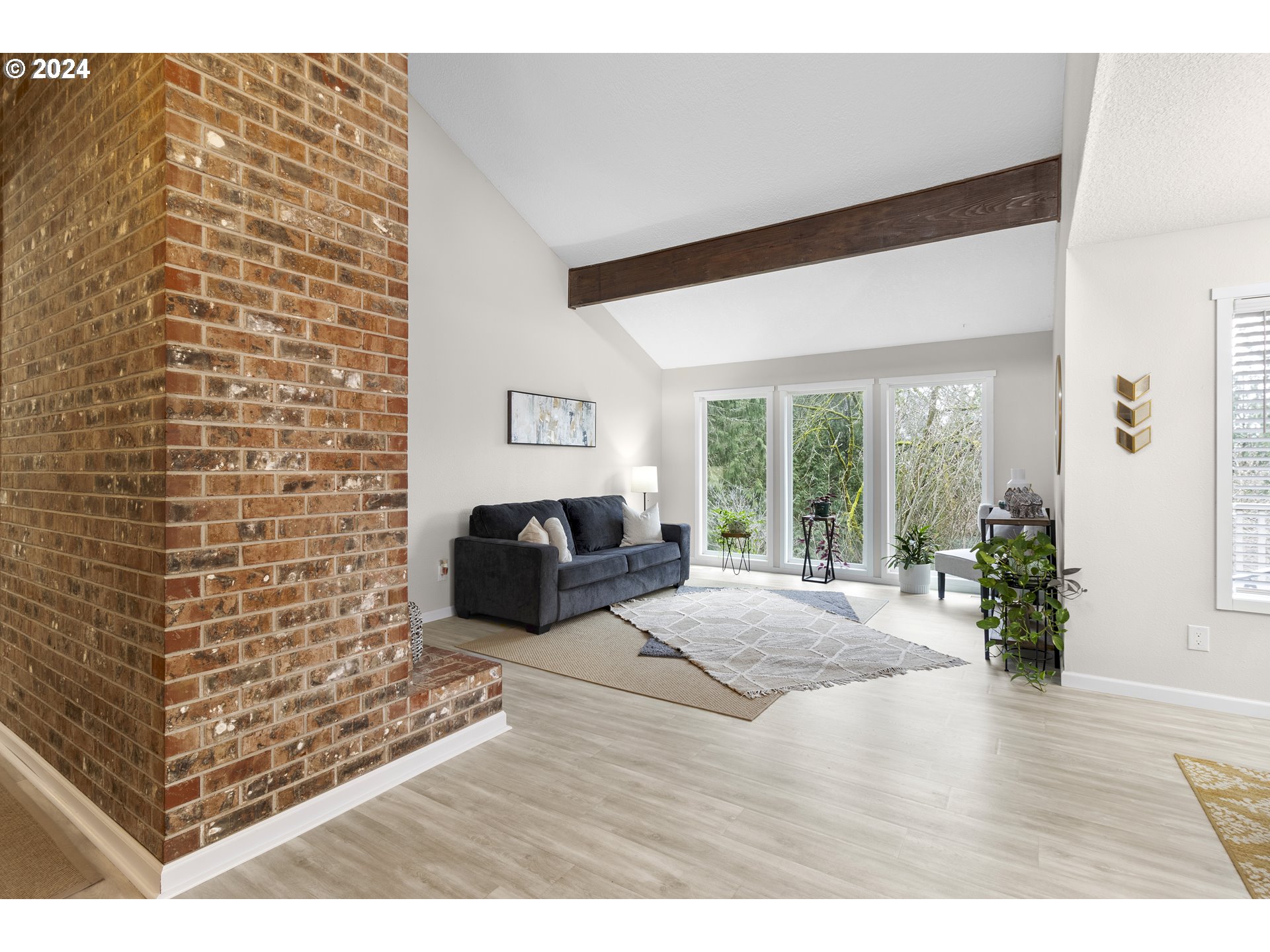 3121 Southwest Orchard Place Gresham, OR 97080 - Photo 7 of 48 a view of livingroom with furniture and floor to ceiling window