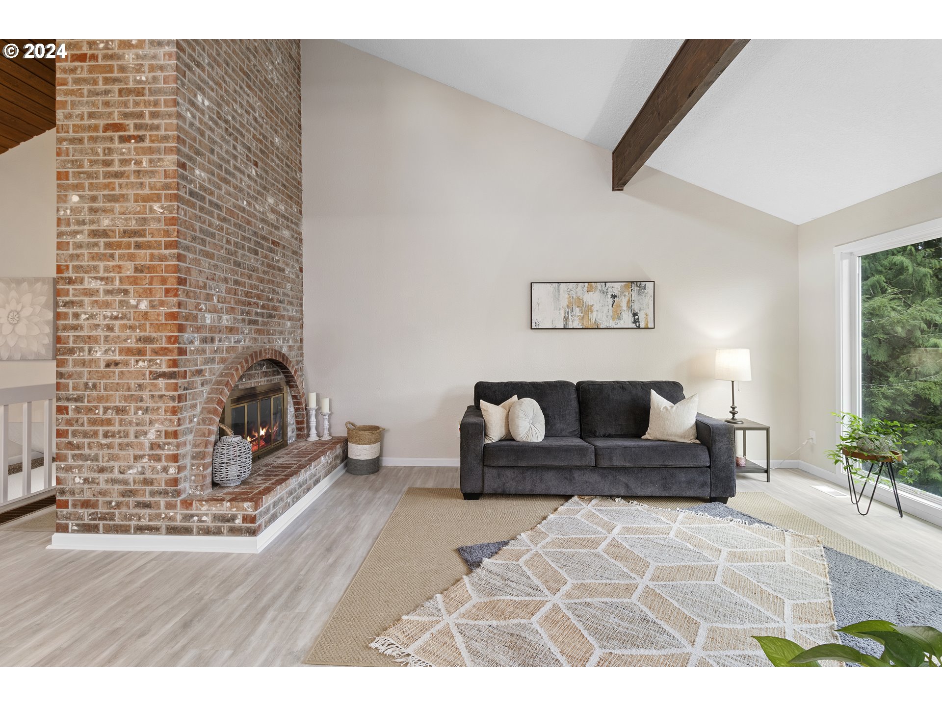 3121 Southwest Orchard Place Gresham, OR 97080 - Photo 8 of 48 a living room with furniture and a fireplace