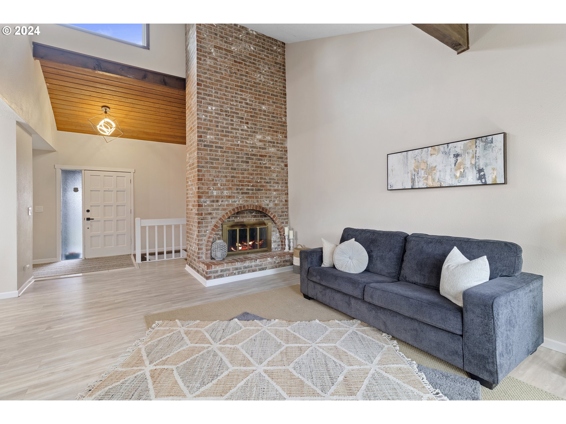 3121 Southwest Orchard Place Gresham, OR 97080 - Photo 9 of 48 a living room with furniture and a fireplace