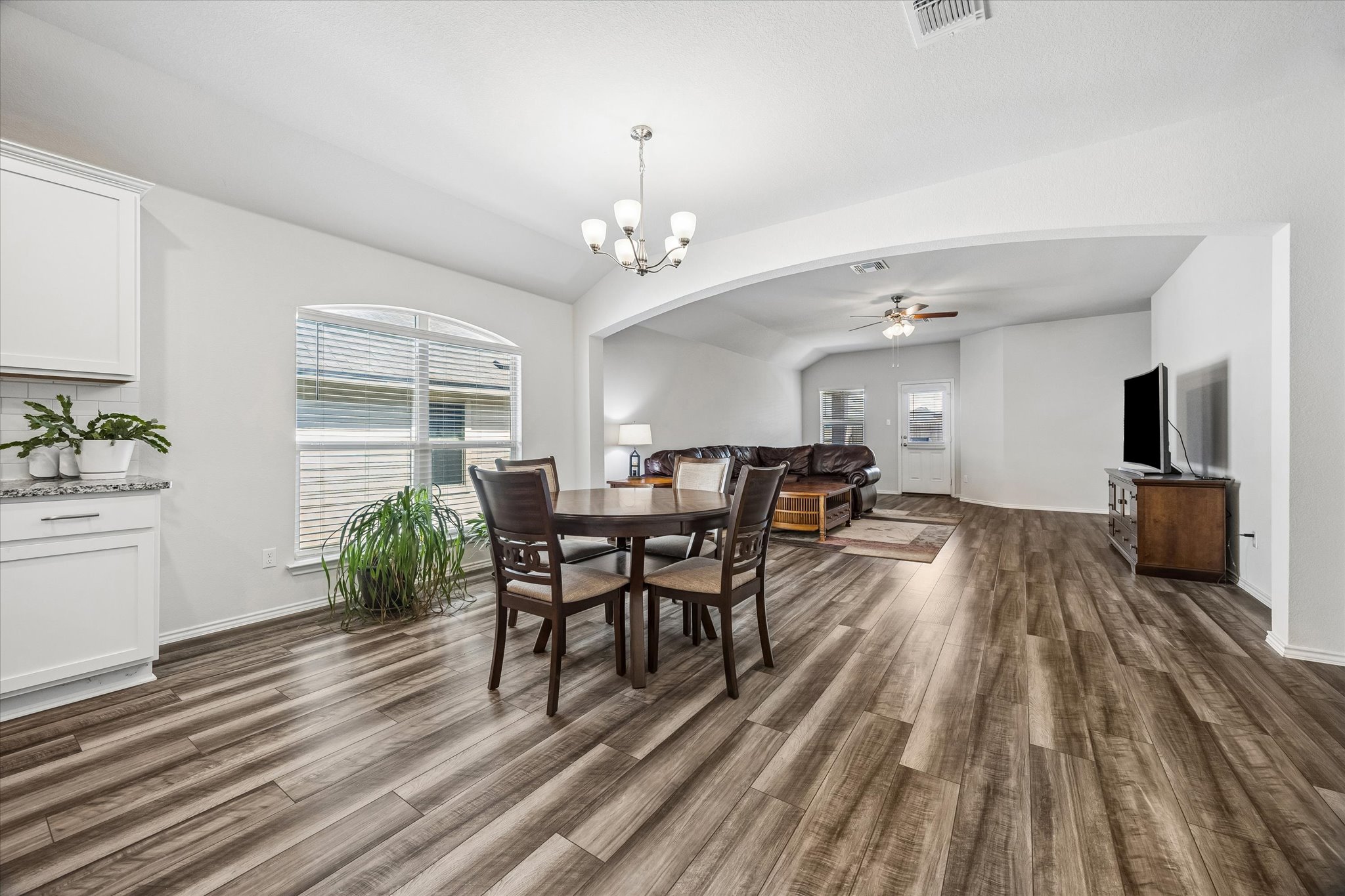 168 Onna Street Taylor, TX 76574 - Photo 10 of 30 a view of a dining room with furniture and wooden floor