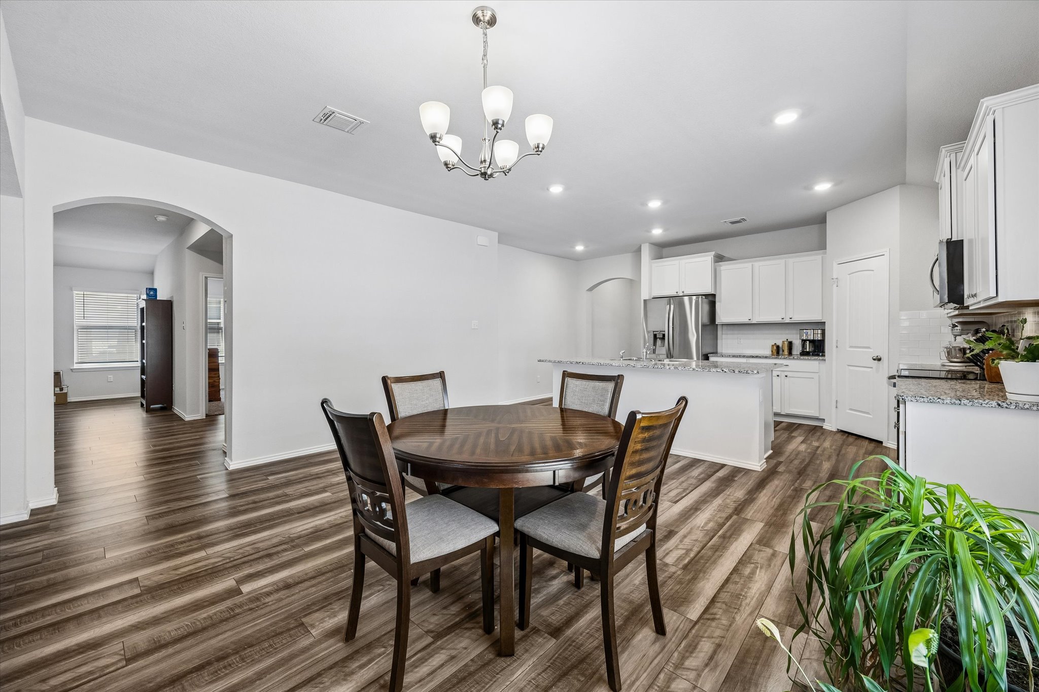 168 Onna Street Taylor, TX 76574 - Photo 11 of 30 a view of a dining room with furniture and wooden floor