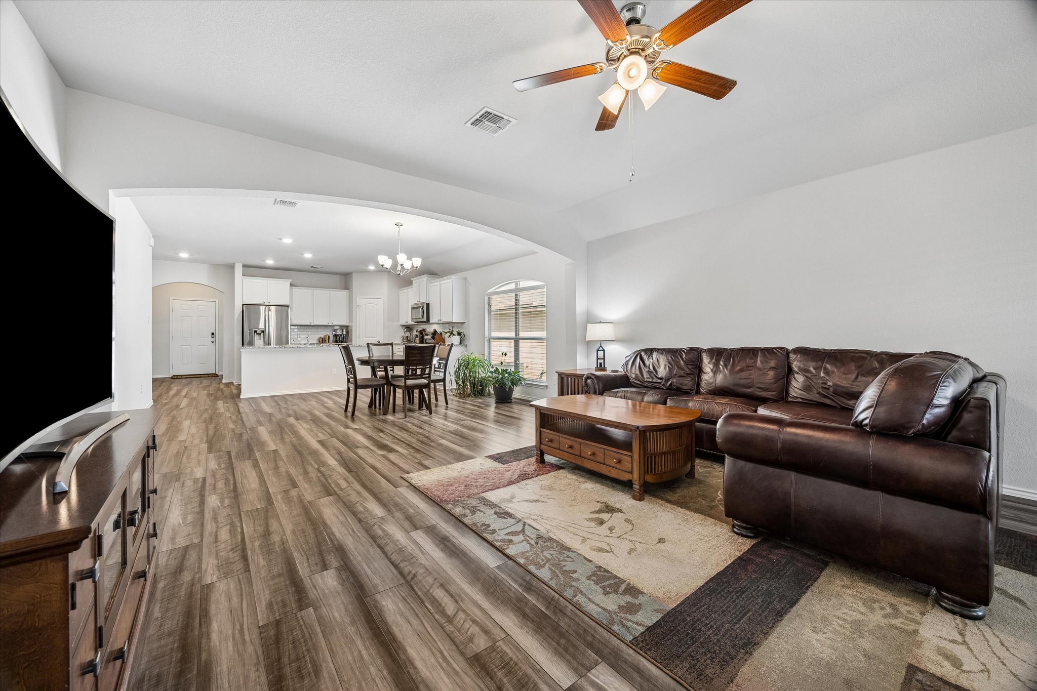 168 Onna Street Taylor, TX 76574 - Photo 15 of 30 a living room with furniture and a wooden floor