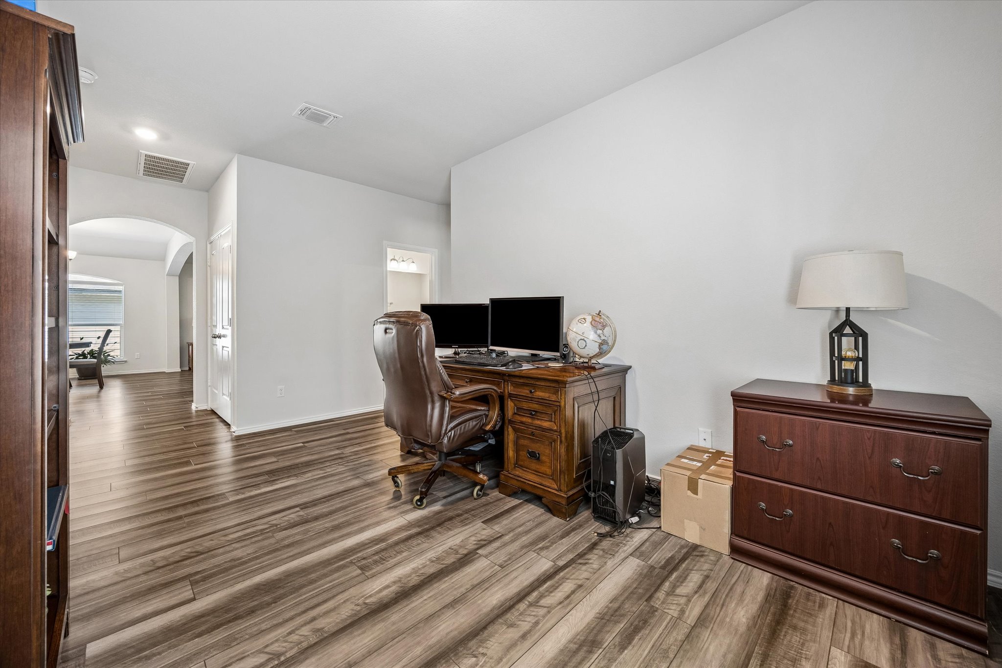 168 Onna Street Taylor, TX 76574 - Photo 16 of 30 a view of a workspace with furniture and wooden floor