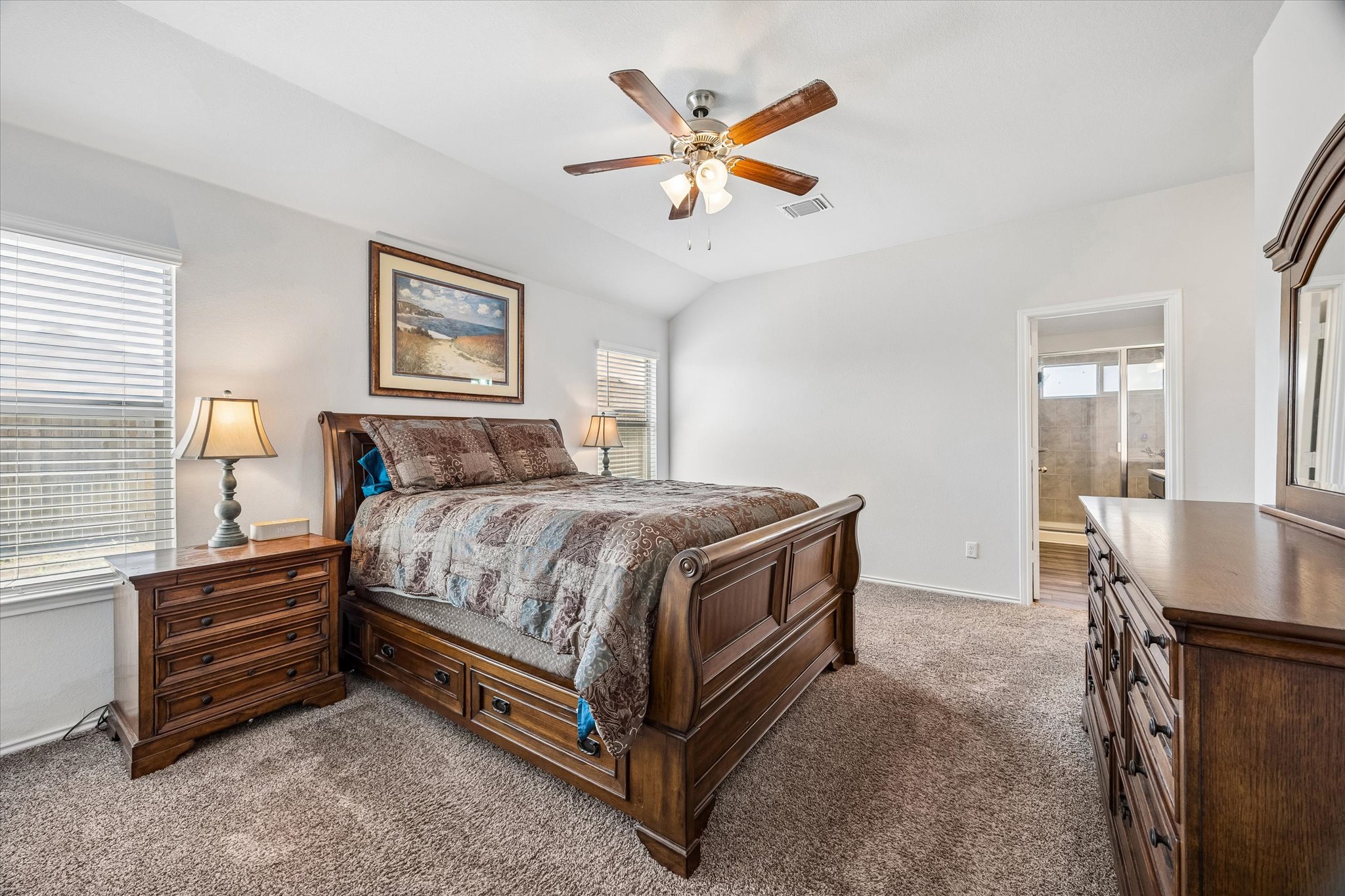 168 Onna Street Taylor, TX 76574 - Photo 20 of 30 a bedroom with a bed and a table in it