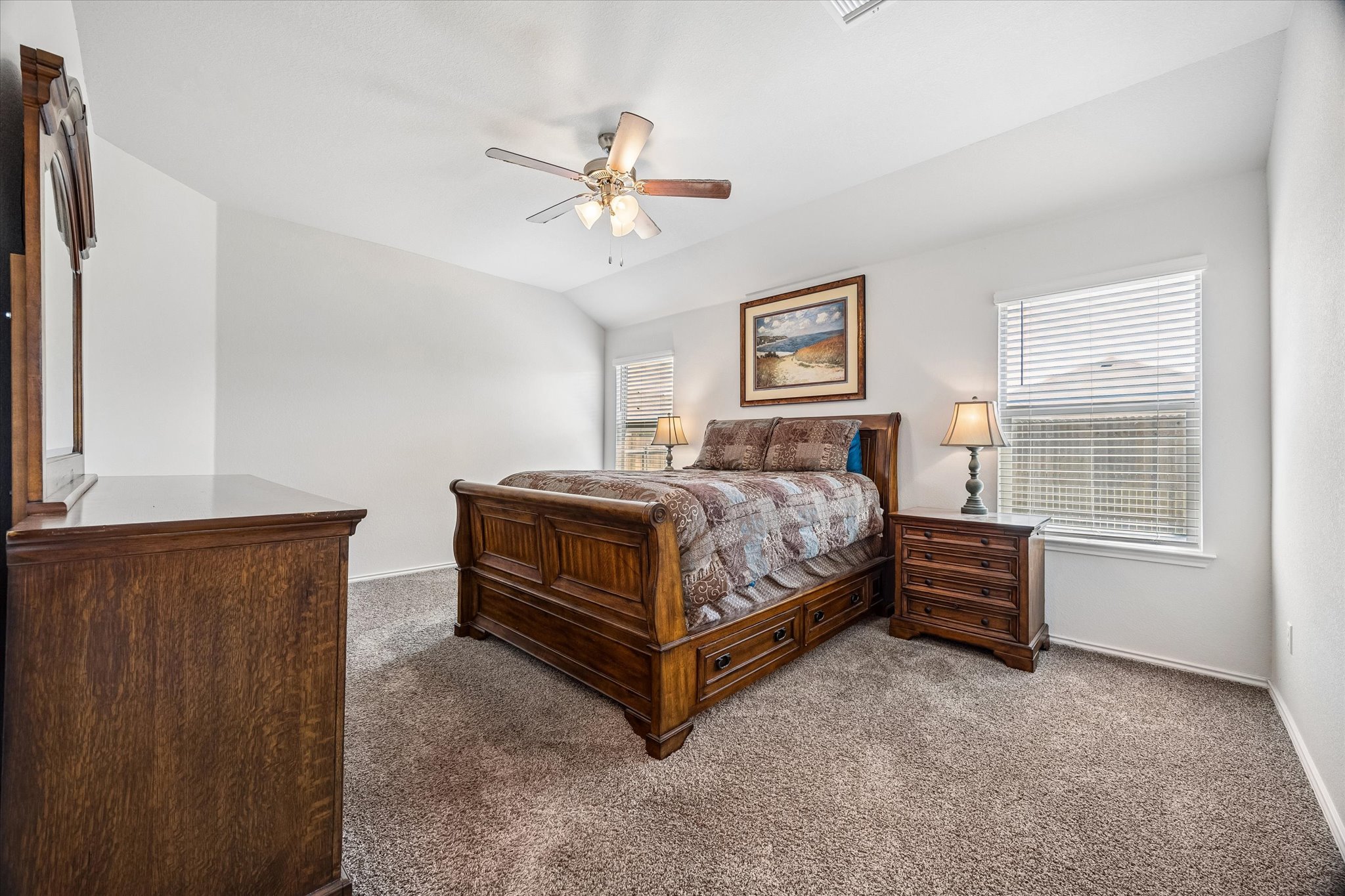 168 Onna Street Taylor, TX 76574 - Photo 21 of 30 a bedroom with a bed and a window