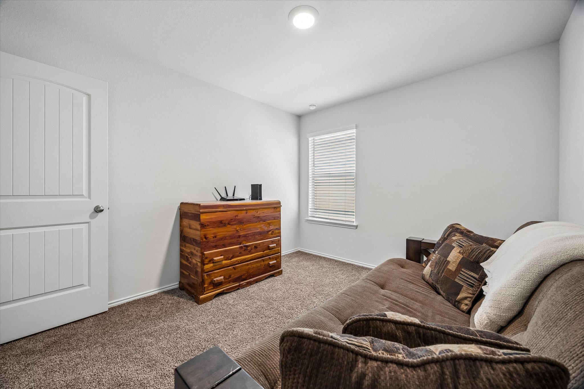 168 Onna Street Taylor, TX 76574 - Photo 23 of 30 a living room with furniture and a window
