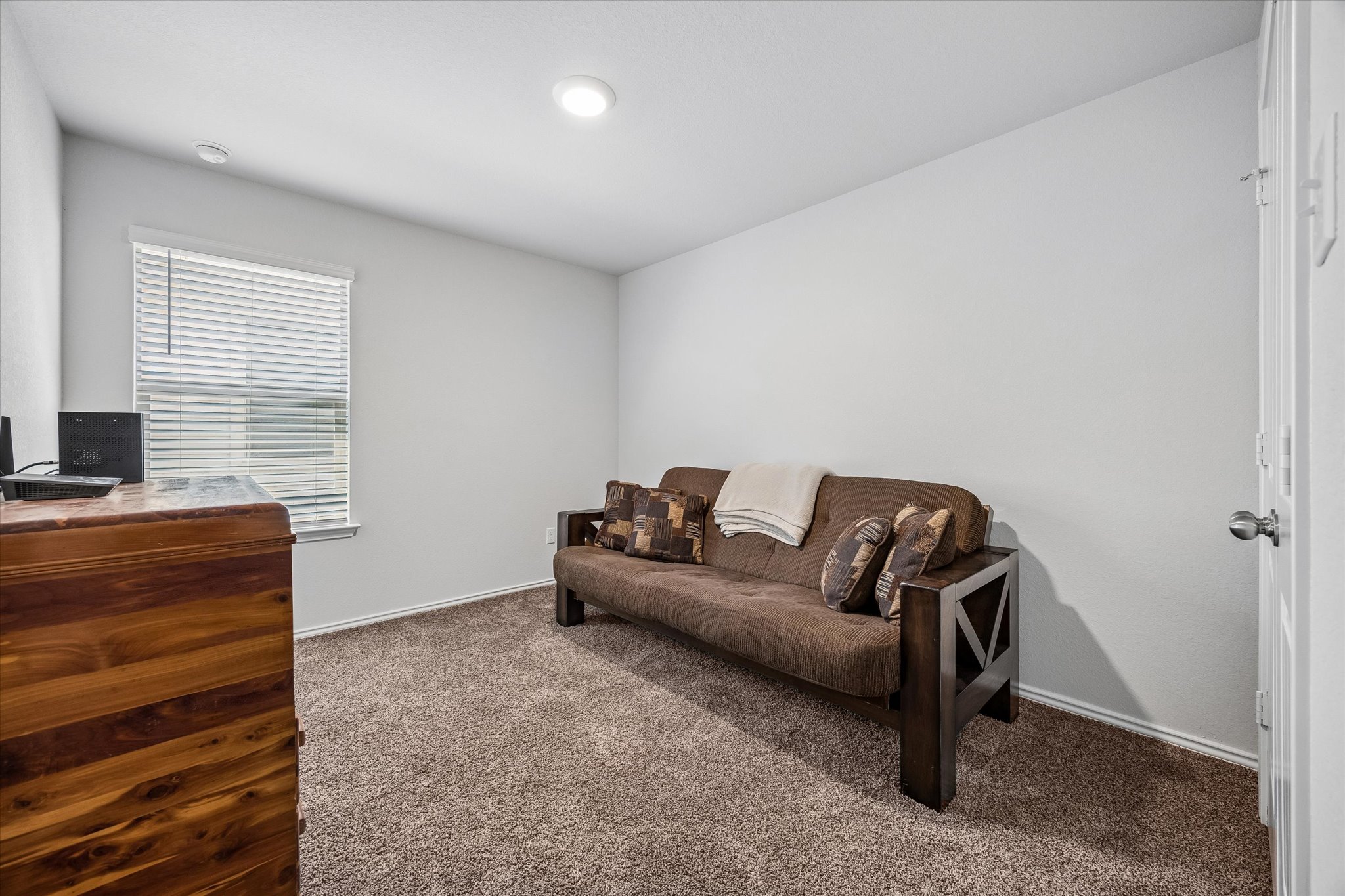 168 Onna Street Taylor, TX 76574 - Photo 24 of 30 a living room with furniture and a flat screen tv
