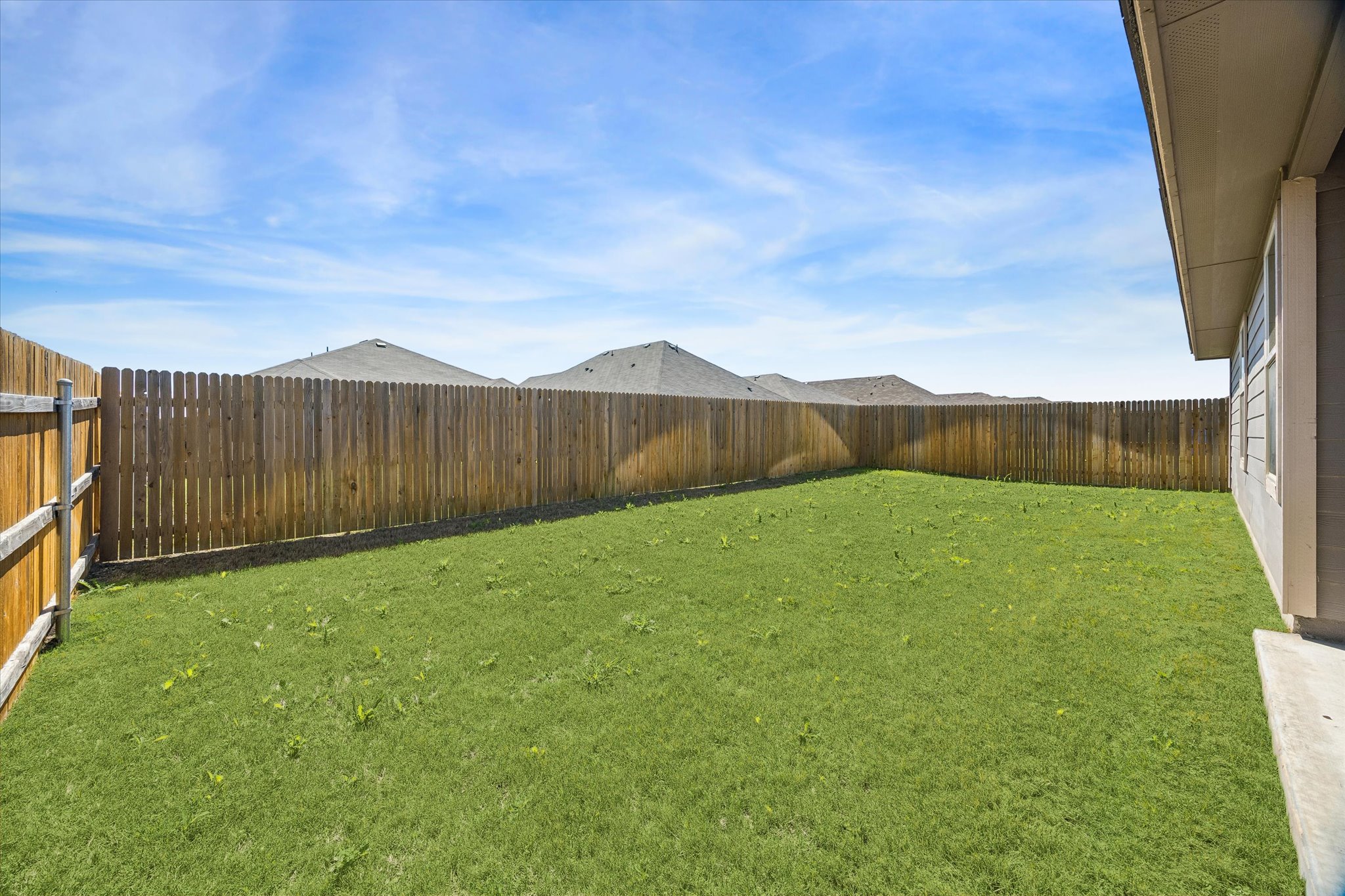 168 Onna Street Taylor, TX 76574 - Photo 26 of 30 a view of an outdoor space and a yard