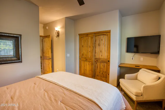 a bedroom with a bed and a couch