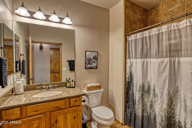 a bedroom with a bed and glass door