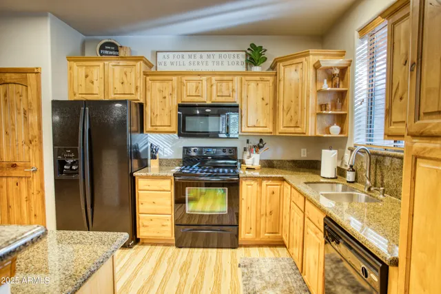 a kitchen with a refrigerator and a sink