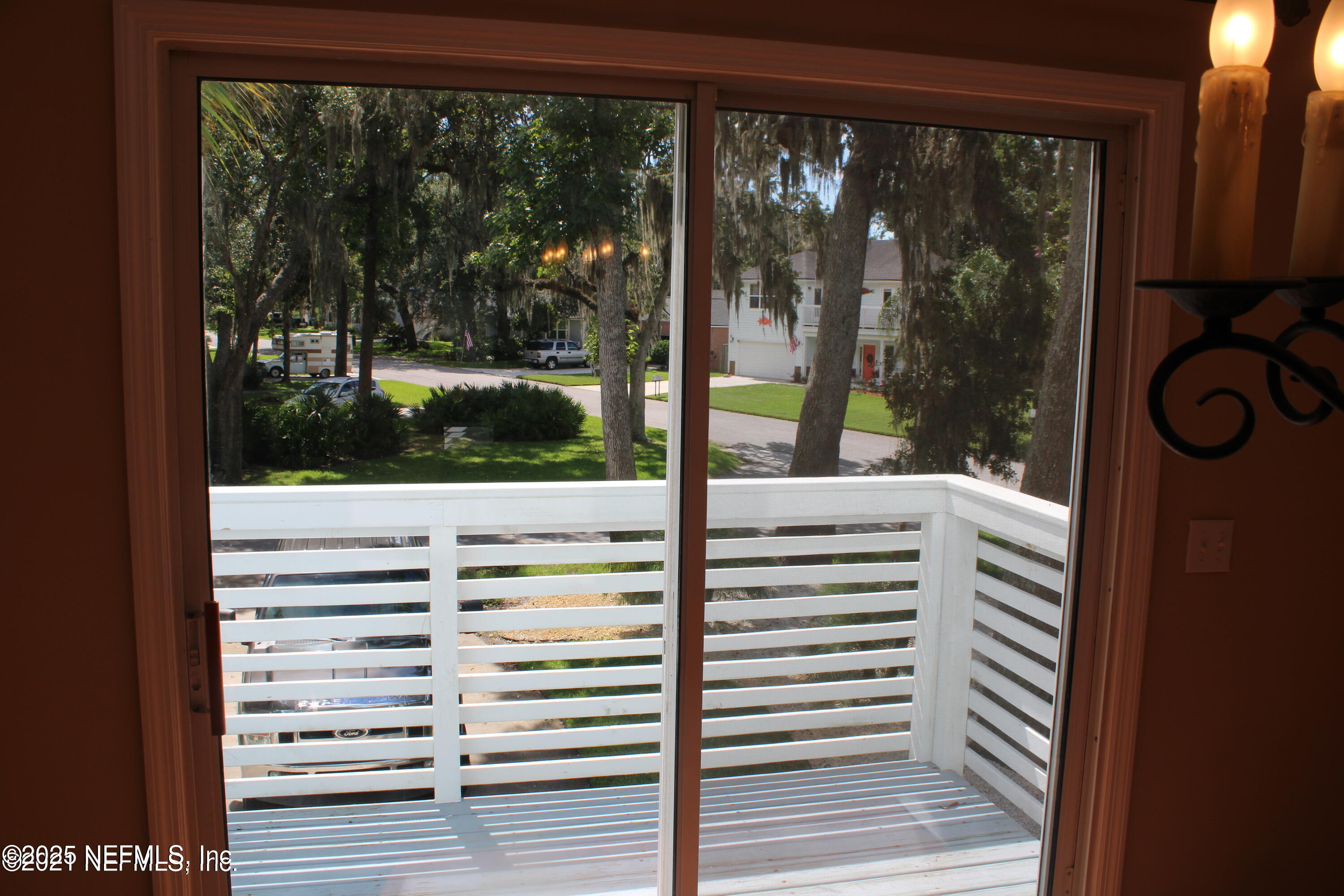 2102 Marsh Point Road, Unit 2102 Neptune Beach, FL 32266 - Photo 6 of 20 a view of a balcony with a floor to ceiling window and wooden floor
