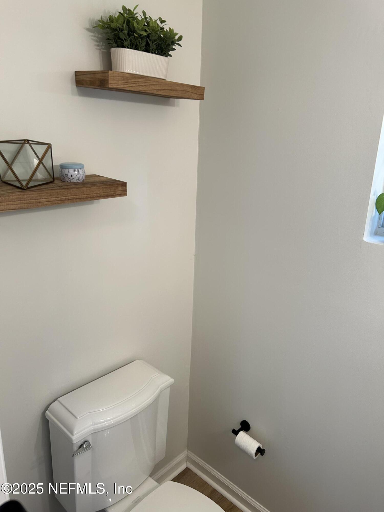 2102 Marsh Point Road, Unit 2102 Neptune Beach, FL 32266 - Photo 9 of 20 a white toilet sitting next to a shower