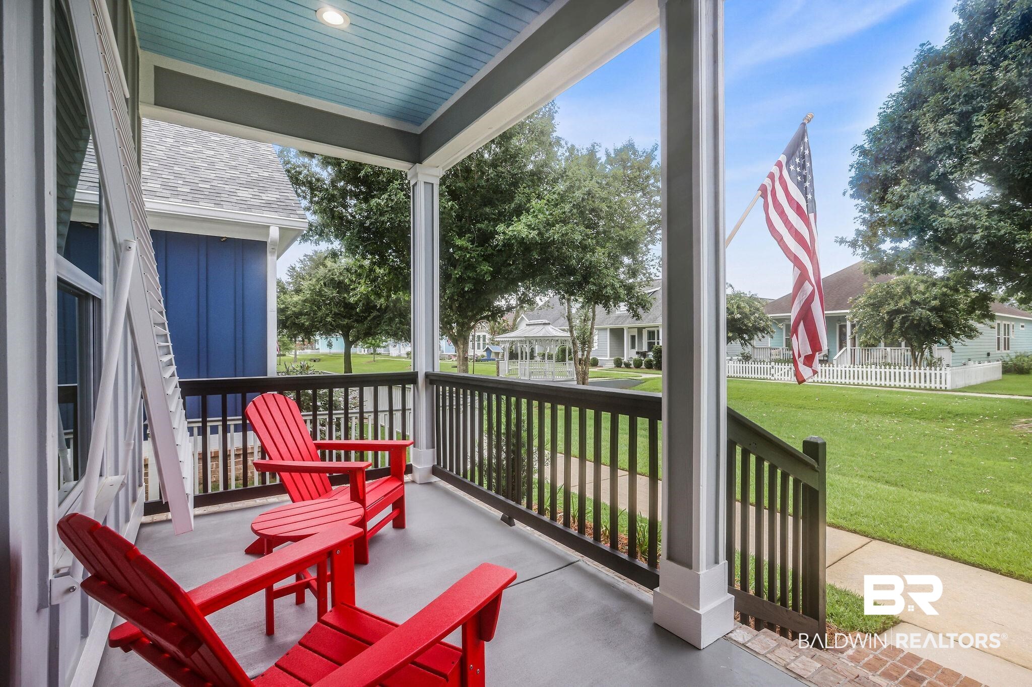 Covered porch with a yard