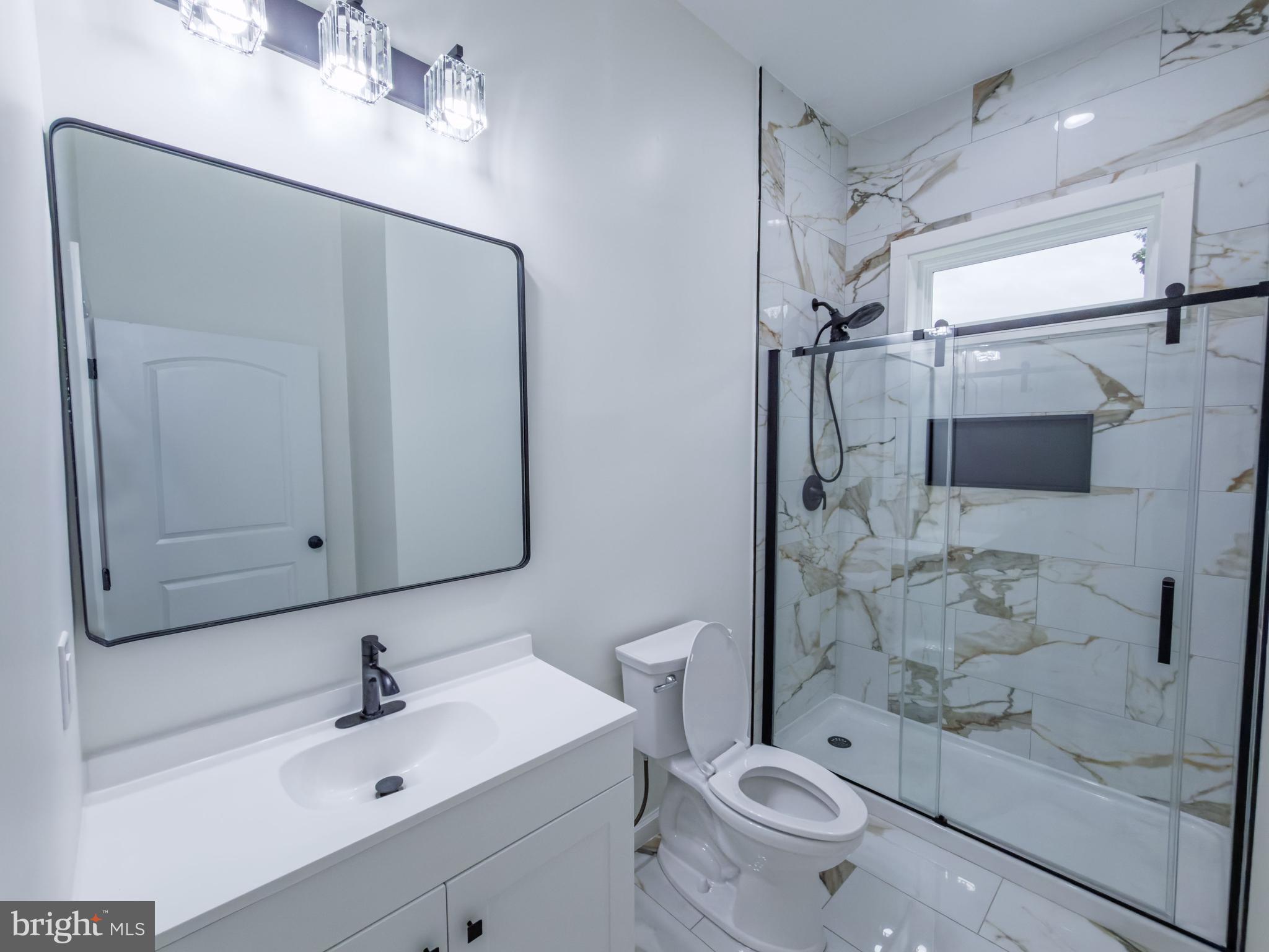 10401 Laurel Ridge Way Fredericksburg, VA 22408 - Photo 12 of 49 a bathroom with a sink a toilet and shower