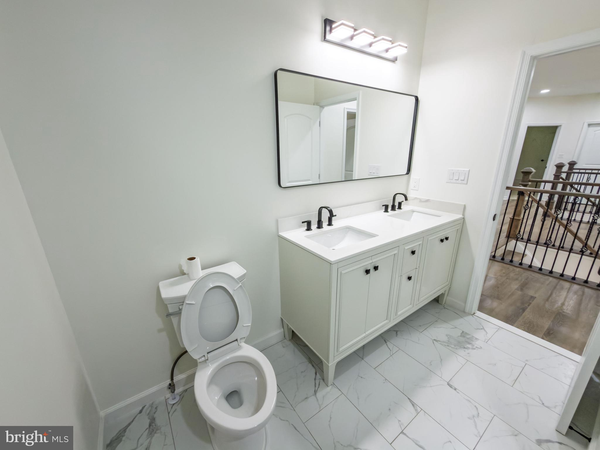 10401 Laurel Ridge Way Fredericksburg, VA 22408 - Photo 19 of 49 a bathroom with a toilet sink and mirror