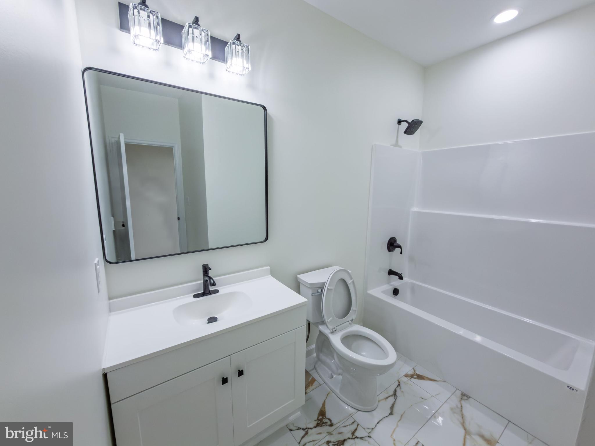 10401 Laurel Ridge Way Fredericksburg, VA 22408 - Photo 23 of 49 a bathroom with a sink toilet and shower