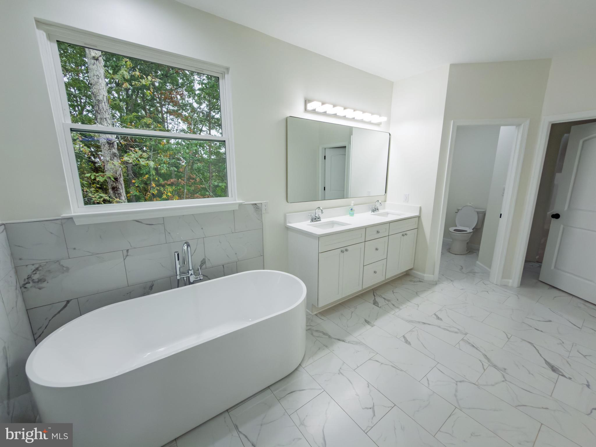 10401 Laurel Ridge Way Fredericksburg, VA 22408 - Photo 28 of 49 a bathroom with a tub toilet and sink