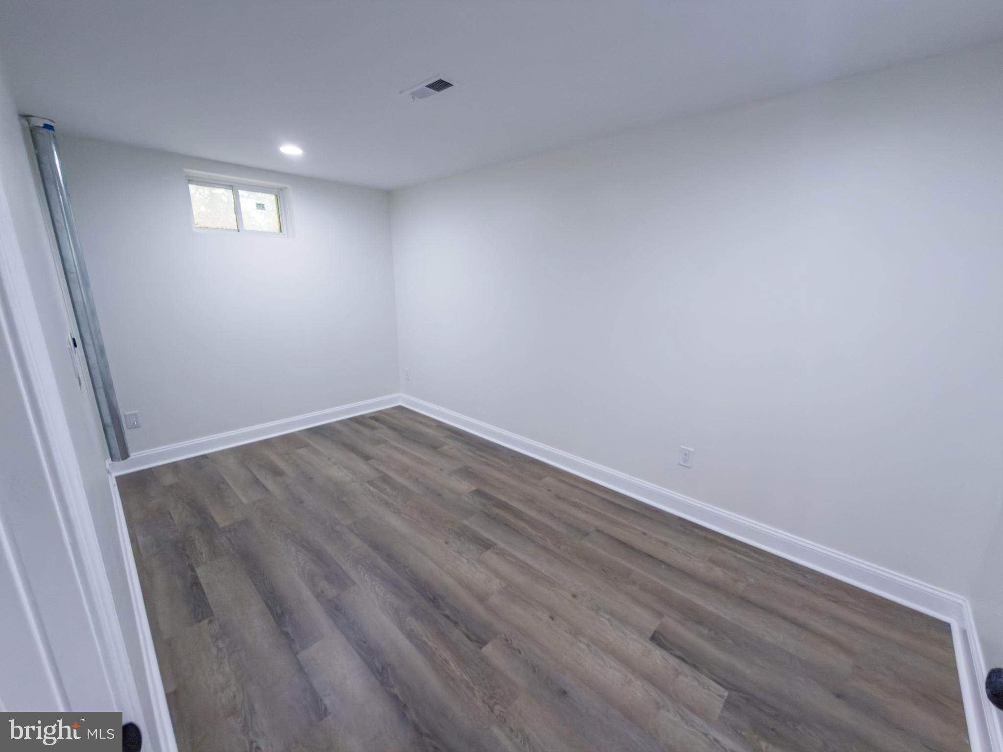 10401 Laurel Ridge Way Fredericksburg, VA 22408 - Photo 34 of 49 a view of room with wooden floor and window