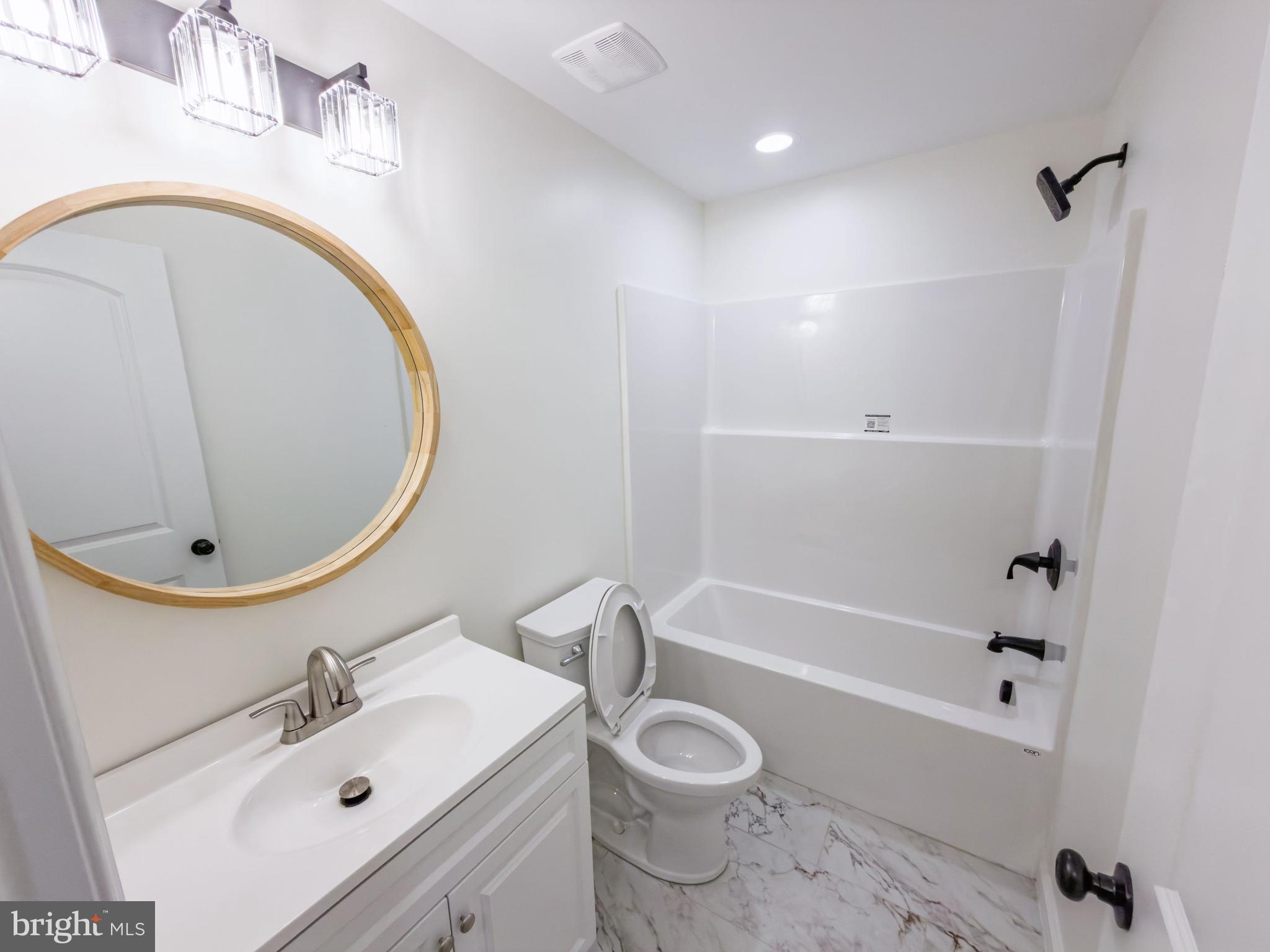 10401 Laurel Ridge Way Fredericksburg, VA 22408 - Photo 36 of 49 a bathroom with a sink a toilet and bathtub