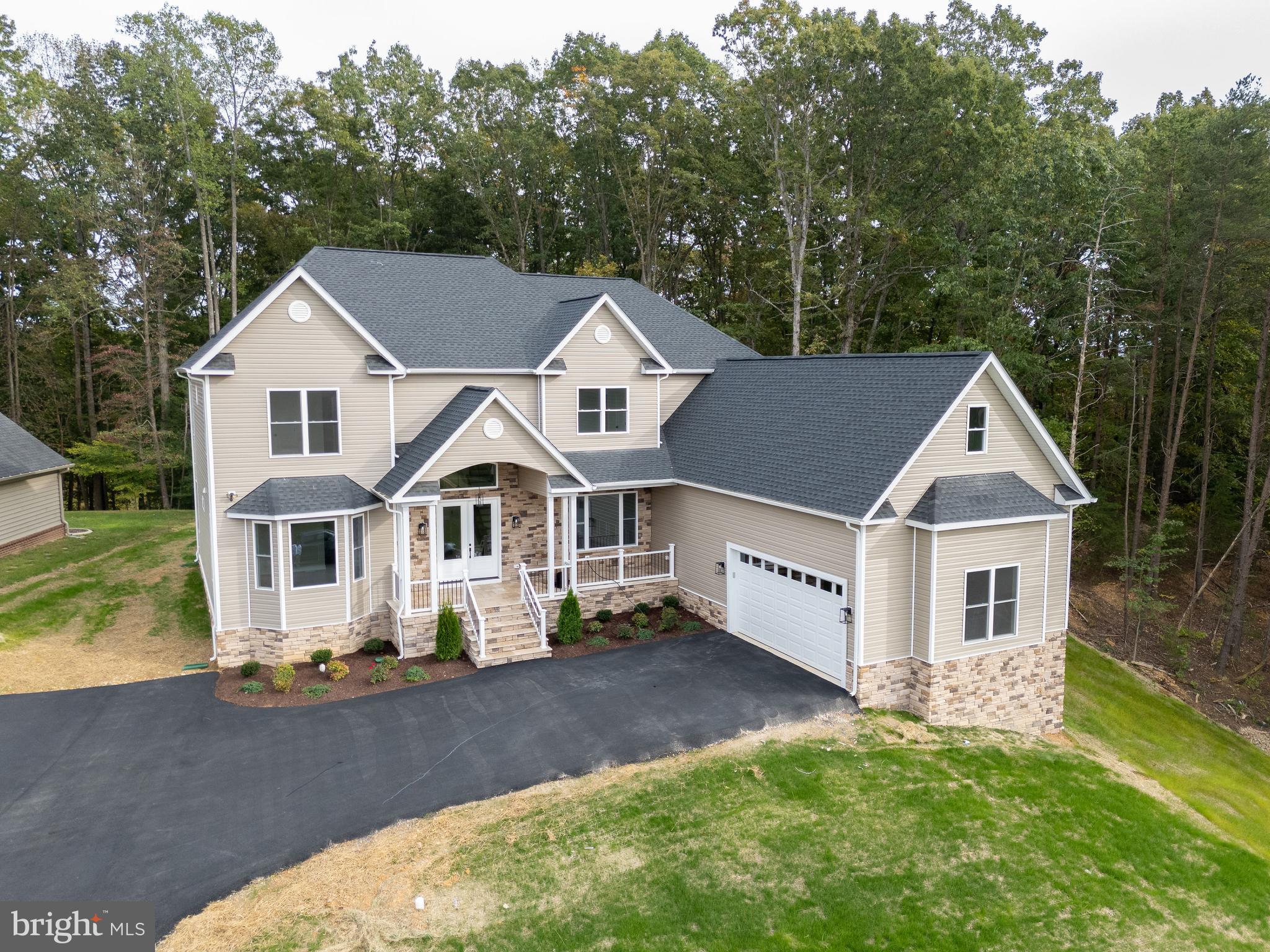 10401 Laurel Ridge Way Fredericksburg, VA 22408 - Photo 4 of 49 front view of a house with a yard