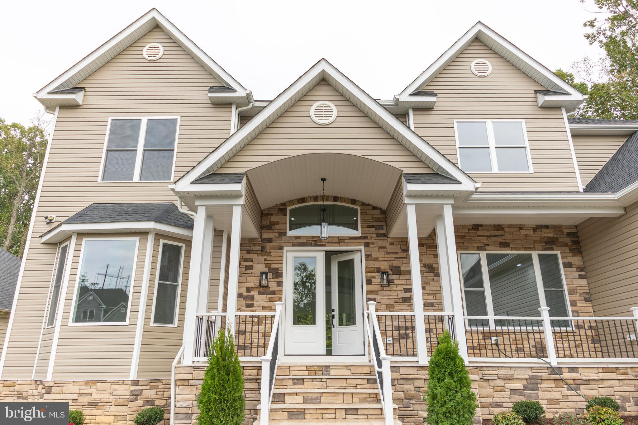 10401 Laurel Ridge Way Fredericksburg, VA 22408 - Photo 45 of 49 a front view of a house with a yard
