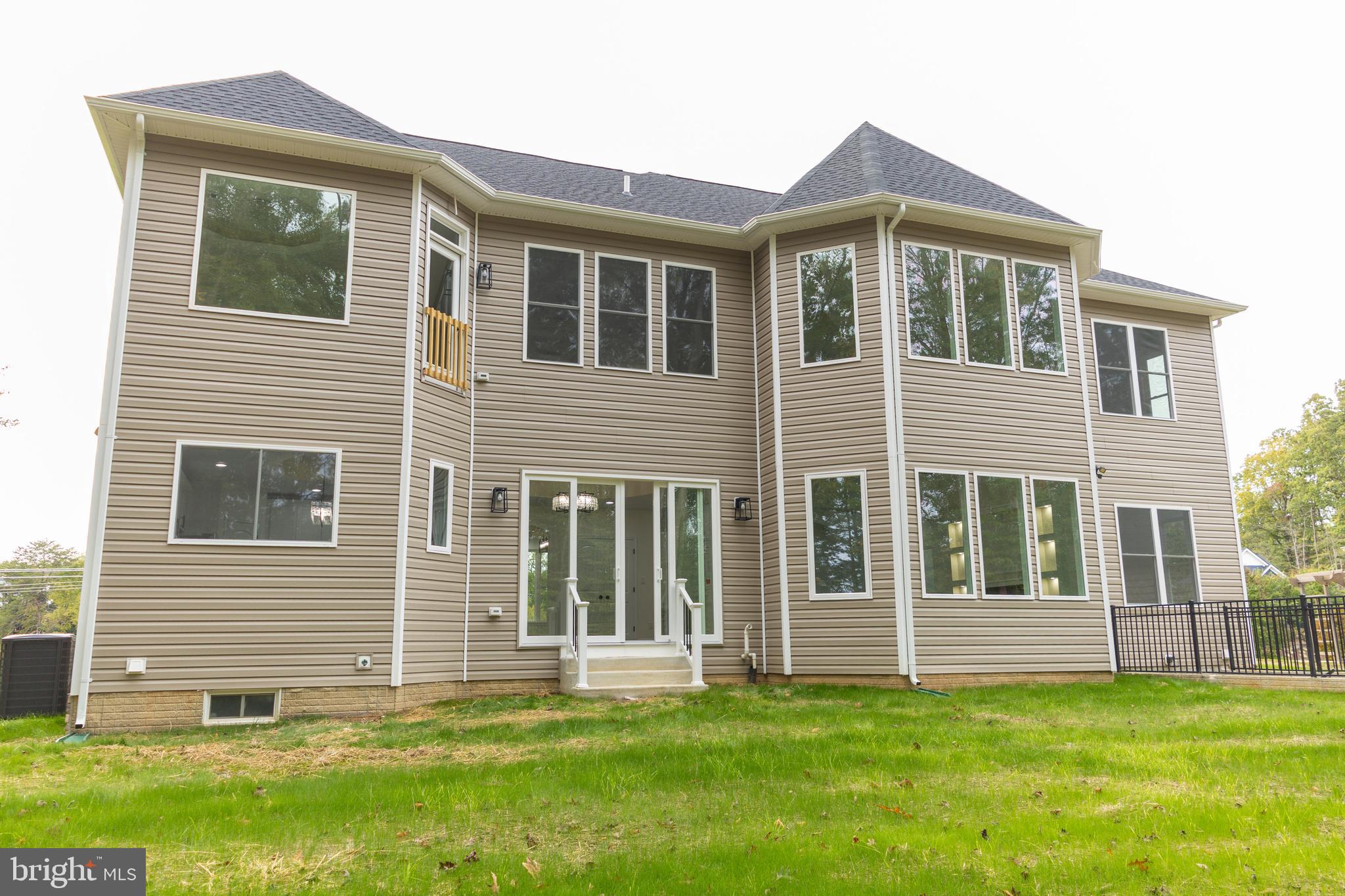 10401 Laurel Ridge Way Fredericksburg, VA 22408 - Photo 46 of 49 a front view of a house with a yard